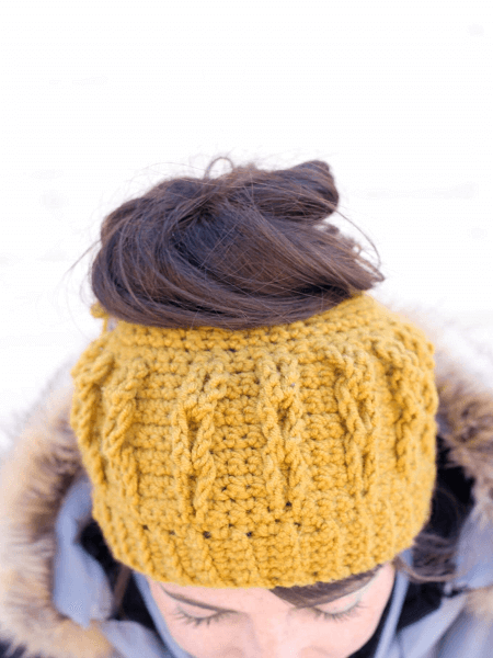 Cabled Free Crochet Messy Bun Hat Pattern by Make And Do Crew
