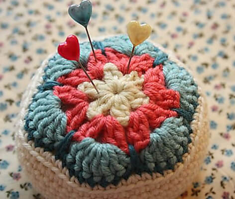  6. Crochet African Flower Pincushion Pattern by Cherry Heart