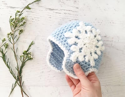 Crochet Snowflake Baby Hat with Ear Flaps Pattern by Yarn Blossom Boutique