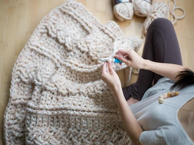 Chunky Braided Cabled Crochet Blanket Pattern by All About Ami