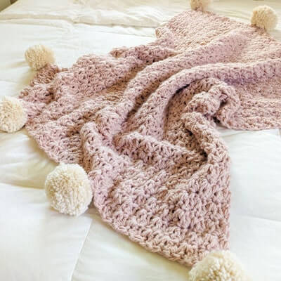 Easy Chunky Crochet Blanket Pattern by Jewels And Jones