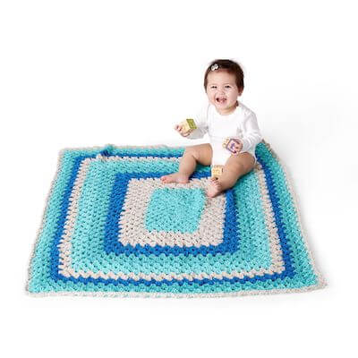 Easy Go Round Crochet Baby Blanket Pattern by Red Heart