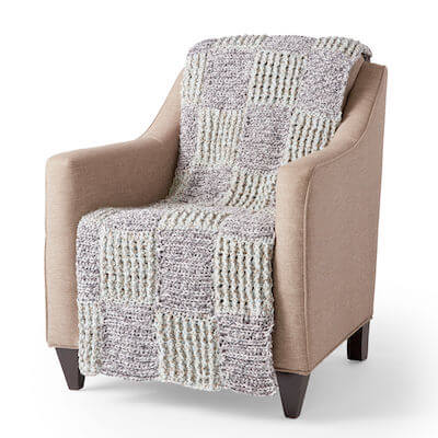 Twisted Grid free Chunky Crochet Blanket Pattern by Yarnspirations