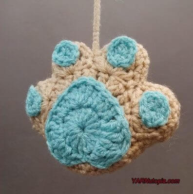 Crochet Paw Print Ornament Pattern by Yarnutopia