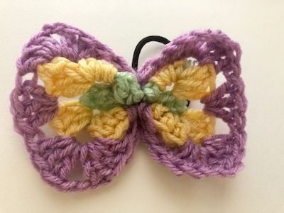 Granny Square Crochet Hair Bow Pattern by The Spruce Crafts