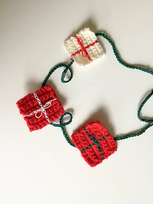Crochet Christmas Package Garland Pattern by Joy Of Motion Crochet
