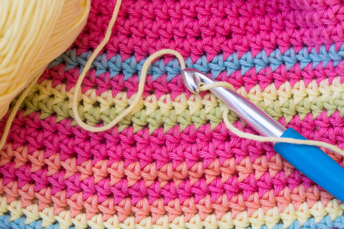 Crocheting uses a crochet hook