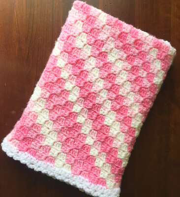 Easy Corner to Corner Crochet Baby Blanket Pattern by Em’s Fiber Arts
