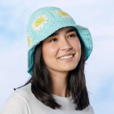 Free Lily Flower Power Granny Square Bucket Hat Crochet Pattern by Yarnspiration